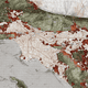 Projected urban growth in Los Angeles overlain on biodiversity data. Dark green indicates remnant vegetation while lighter green indicates protected areas. Red areas are regions of expected urban-biodiversity conflicts in 2030. Image: Richard Weller / Hotspot Cities